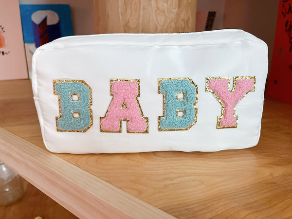 White Baby Pouch With Pink and Blue Letters